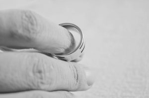 Hand holding wedding ring