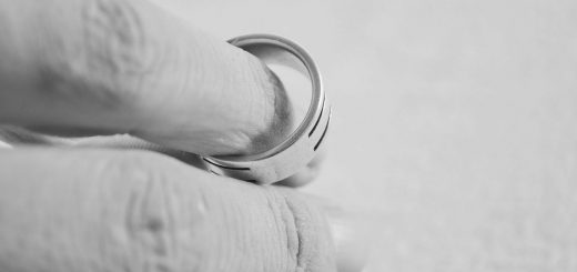 Hand holding wedding ring